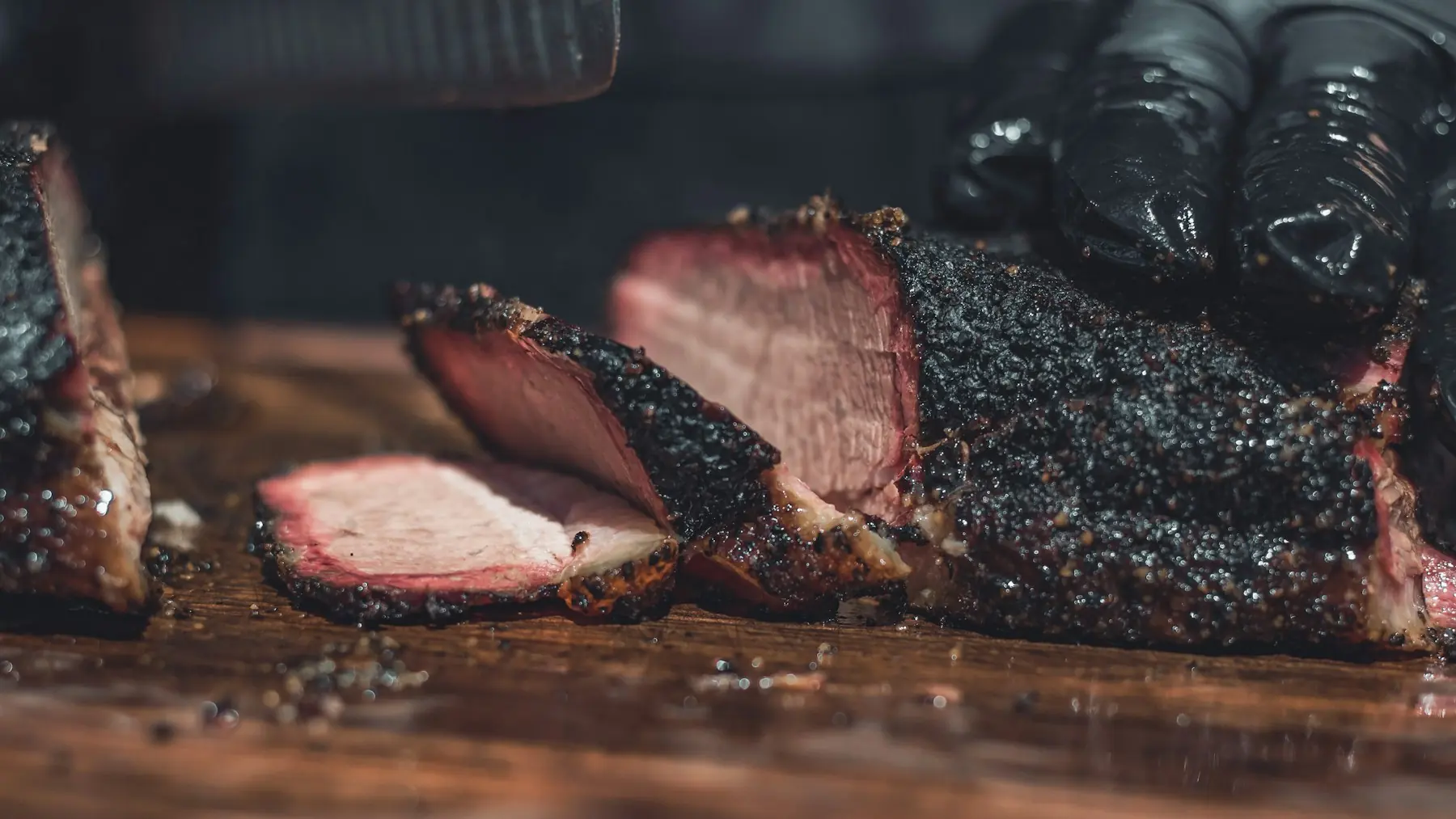 Smoked brisket sliced on a cutting board